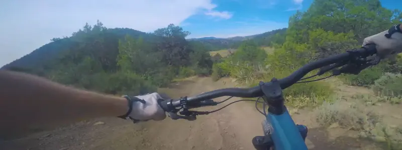 A biker with good posture and bent elbows to absorb shock