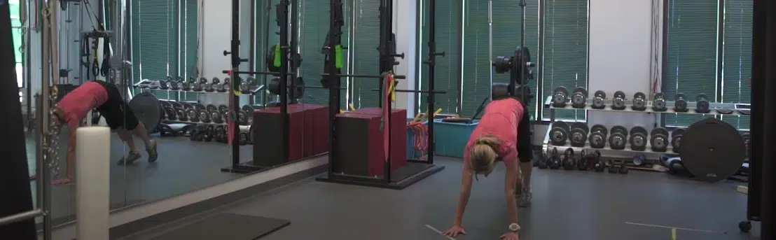 A cyclist demonstrating a hip crossover stretch