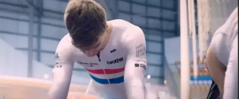 A cyclist scratching their head due to dandruff itching