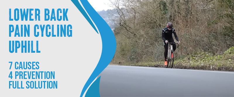A cyclist with lower back pain while climbing a hill