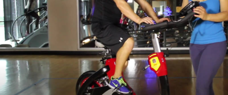 A happy cyclist enjoying a good cardio workout outdoors