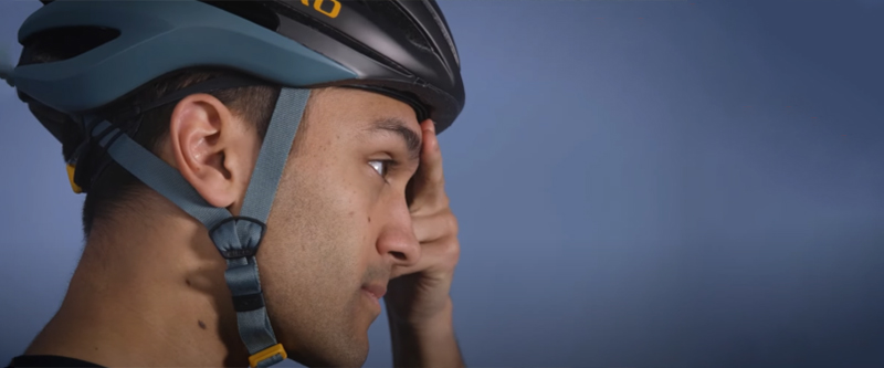 Bike fitter adjusting handlebar height to improve posture