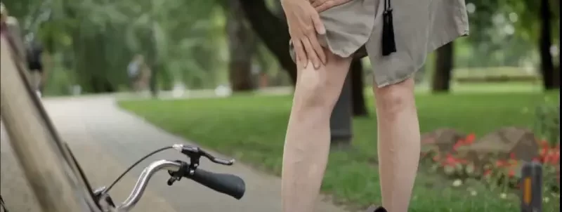 Cyclist Experiencing Leg Pain from Gas