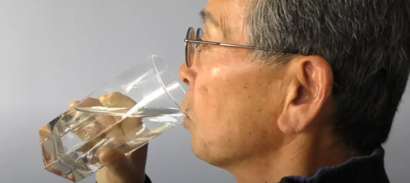 Cyclist staying hydrated to support lymphatic health