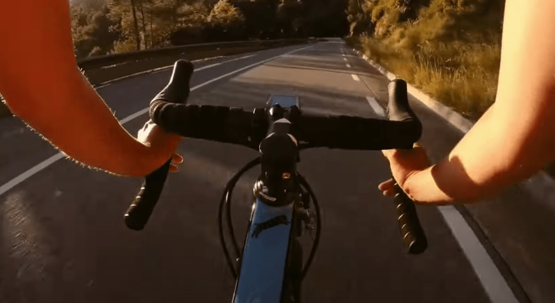 Cyclist using a hand signal to communicate with traffic