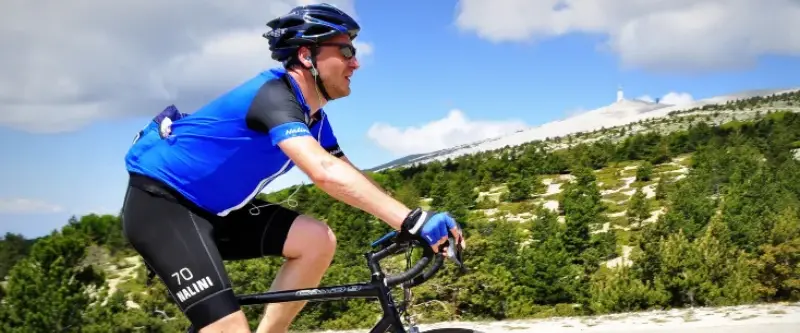 Cyclist wearing wraparound sunglasses for UV eye protection