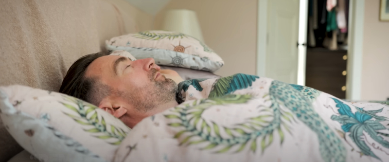 Cyclist with painful red sunburn on their back and shoulders