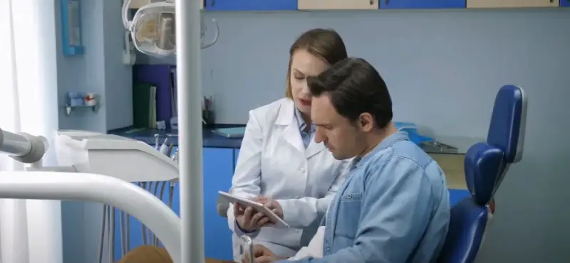 Doctor examining cyclist for concussion symptoms