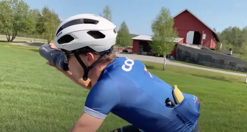 Staying hydrated by drinking water on a bike ride