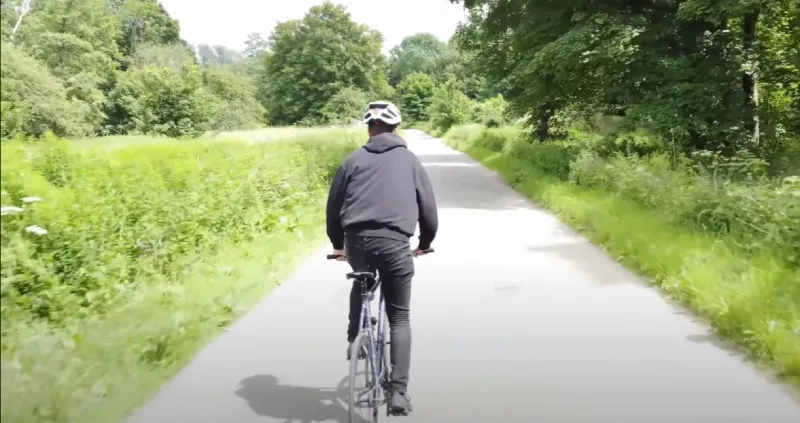 Wearing a sweatband under a helmet to absorb sweat