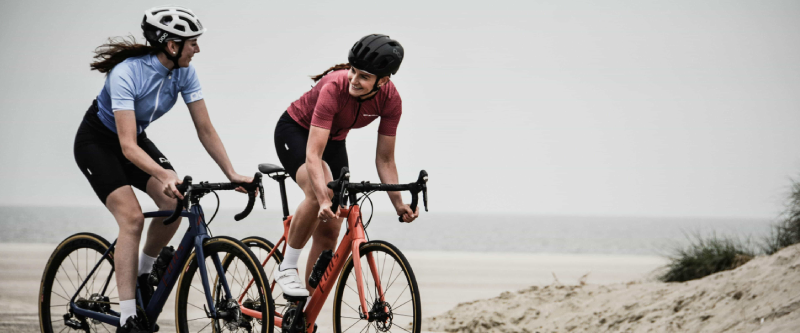 Woman wearing a helmet and reflective gear for road safety